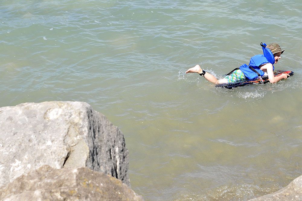 A photo of a boy swimming.